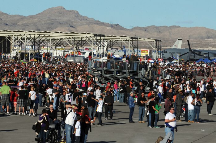 NELLIS AIR FORCE BASE, Nev. -- Visitors watch as the U.S. Air Force Air Demonstration Squadron "Thunderbirds," pass overhead at the 2010 Aviation Nation Open House, Nov. 14, 2010. The Nellis Open House is an opportunity for the Las Vegas community to view aerial demonstrations and static displays of various aircraft from the military. The open house also acts as the final air show of the year for the U.S. Air Force Air Demonstration Squadron, "Thunderbirds."  (U.S. Air Force Photo by Airman 1st Class Jamie Nicley)(Released)