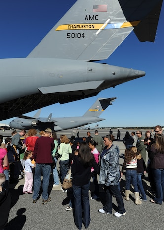 Children and family members tour a static C-17 during the Children's Deployment Line after receiving their deployment briefings Nov. 13, 2010, on Joint Base Charleston, S.C. The Children's Deployment Line consisted of face painting, briefings, picking up combat gear, touring a C-17 and finally eating simulated Meals, Ready-to-Eat (MREs) for lunch. (U.S. Air Force photo/Senior Airman Timothy Taylor)