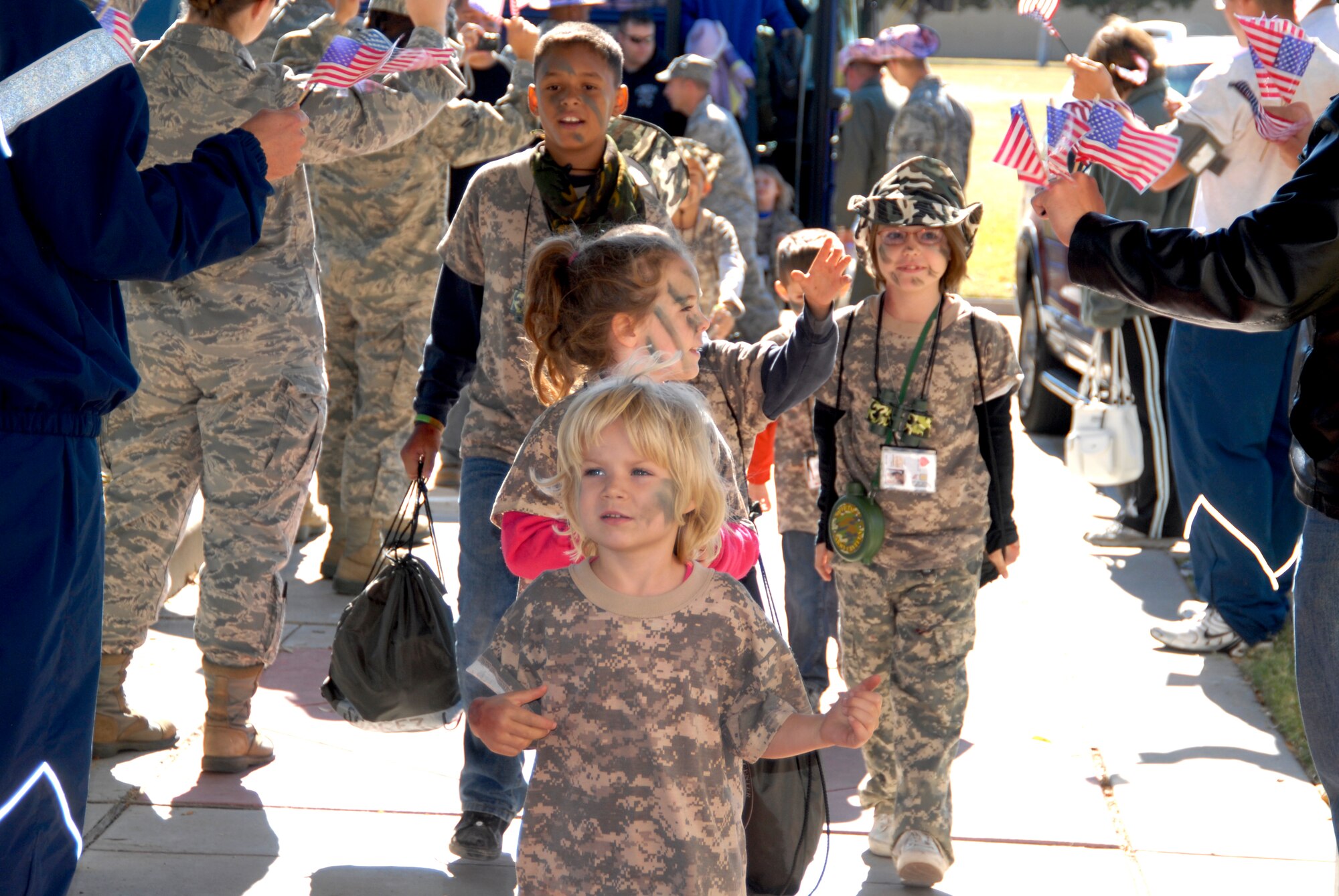 GOODFELLOW AIR FORCE BASE, Texas -- Georgia Shirley, 5, leads her squad to the Welcome Home celebration at the Event Center Nov. 13 for the Operation KIDS 2010 participants.  More than 60 military youths participated in this year's event to get a glimpse of what their military parent(s) go through when deploying.  (U.S. Air Force photo/Connie Hempel)