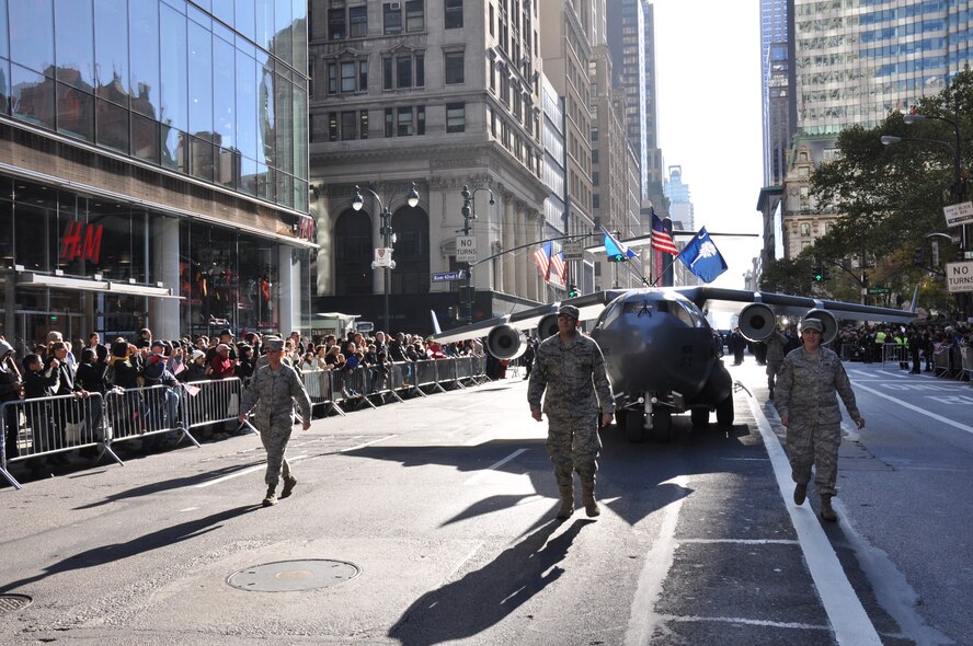 Members of the 315th Airlift Wing, Joint Base Charleston, S.C. joined the mini C-17 replica in the annual New York City Veterans Day Parade Nov. 12. The parade, which is the largest of its kind in the country, covered more than 30 blocks down 5th Ave in midtown Manhattan and was viewed by millions of people around the world. (U.S. Air Force Photo/1st Lt Joe Simms)
