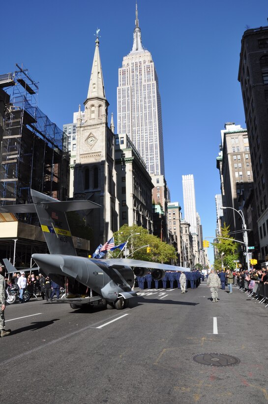 Members of the 315th Airlift Wing, Joint Base Charleston, S.C. joined the mini C-17 replica in the annual New York City Veterans Day Parade Nov. 12. The parade, which is the largest of its kind in the country, covered more than 30 blocks down 5th Ave in midtown Manhattan and was viewed by millions of people around the world. (U.S. Air Force Photo/1st Lt Joe Simms)
