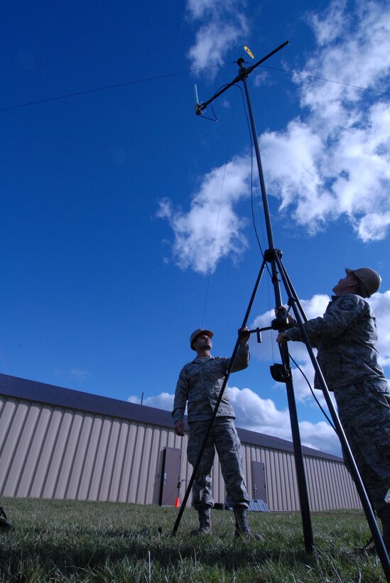 Tech. Sgt. Mohommad Ali 914th Communications cyber transport operations technician (left) and Master Sgt. Daryl Hoppough 914th Communications Squadron noncommissioned officer in charge of Joint Incident Site Communications Capability systems maintain a JISCC antenna outside of a 914th Communications squadron building November 7 2010 at the Niagara Falls Air Reserve Station, NY (U.S. Air Force Photo by Senior Airman Andrew Caya 914th Airlift Wing Public Affairs)