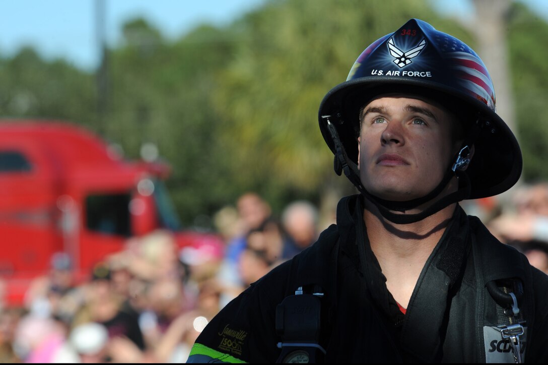 Senior Airman Robert Anderson watches his teammate during the relay competition Nov. 13, 2010, at the 2010 Scott Firefighter Combat Challenge in Myrtle Beach, S.C. Airman Anderson is assigned to the 52nd Civil Engineer Squadron at Spangdahlem Air Base, Germany.  (U.S. Air Force photo/Staff Sgt. Desiree N. Palacios)