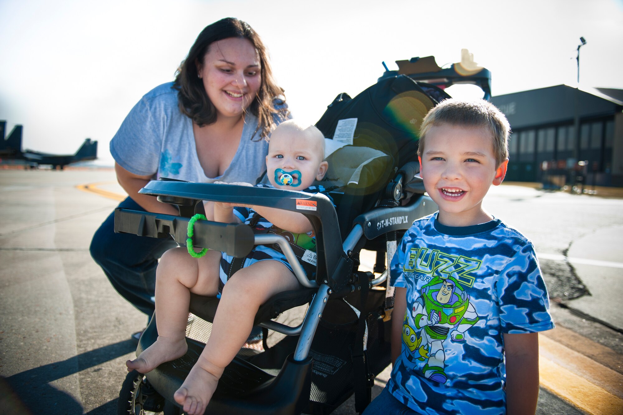 MOODY AIR FORCE BASE, Ga. -- Kristy Jansen and her sons, Lucas and Ethan (infant), observe an air demonstration during the Community Appreciation Day Air Show practice session Nov. 12. This was Ethan's first air show experience and the second at Moody for the rest of the family. Kristy, Lucas and Ethan are family members of Staff Sgt. Michael Jansen, 23rd Component Maintenance Squadron. "These air shows are awesome because it gives us a chance to see aircraft up-close and enjoy the demonstrations," said Mrs. Jansen. (U.S. Air Force photo/Senior Airman Jamal D. Sutter)(RELEASED)