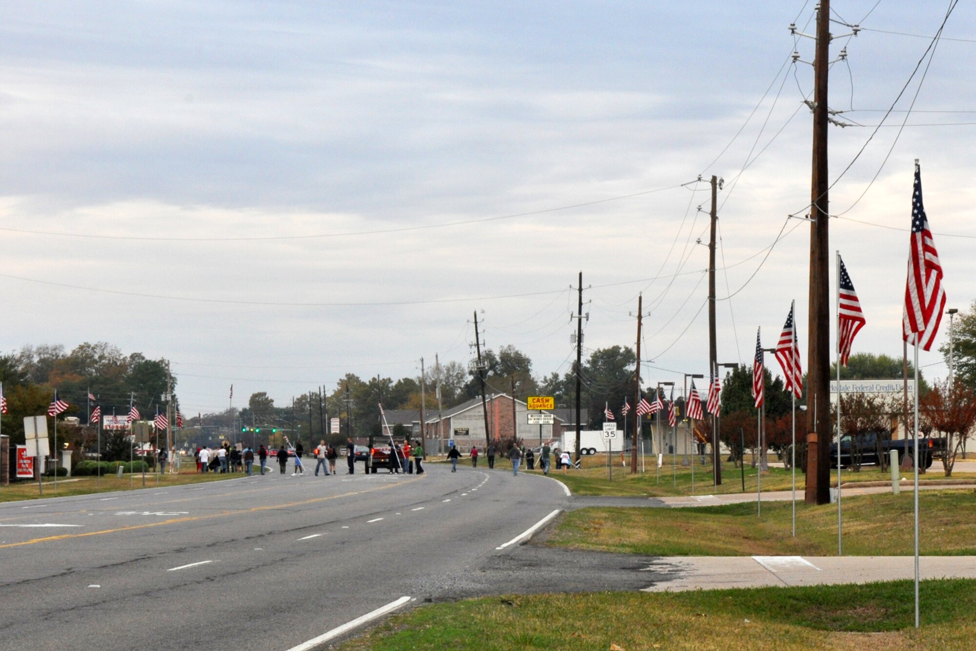 Approximately 40 Barksdale Airmen placed 85 American Flags along North Gate Road to commemorate Veteran's Day at Barksdale Air Force Base, La., Nov. 11, 2010. Volunteers for the flag detail, which included another group of 17 Airmen putting up an additional 92 flags on base along Barksdale Air Force Base Boulevard, came from Barksdale Team 56, the First Term Airman Center, Airman Leadership School - Class 11-02 and the 917th Wing. The flags lined the road for approximately a half mile from the North Gate to Patricia Drive, and were removed approximately 11 hours later, at the end of the day. (U.S. Air Force photo/Tech. Sgt. Jeff Walston)