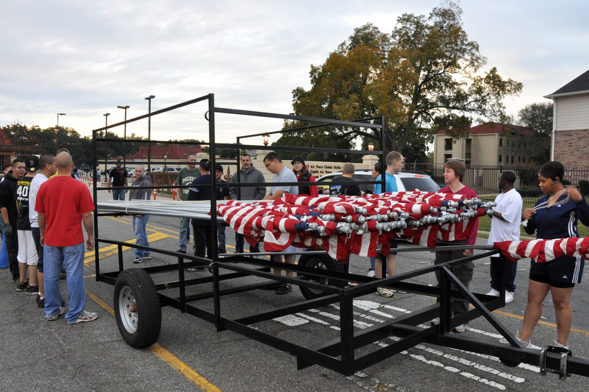 Approximately 40 Barksdale Airmen prepare to post 85 American Flags along North Gate Road to commemorate Veteran's Day at Barksdale Air Force Base, La., Nov. 11, 2010. Volunteers for the flag detail, which included another group of 17 Airmen putting up an additional 92 flags on base along Barksdale Air Force Base Boulevard, came from Barksdale Team 56, the First Term Airman Center, Airman Leadership School - Class 11-02 and the 917th Wing. The flags lined the road for approximately a half mile from the North Gate to Patricia Drive, and were removed approximately 11 hours later, at the end of the day. (U.S. Air Force photo/Tech. Sgt. Jeff Walston)