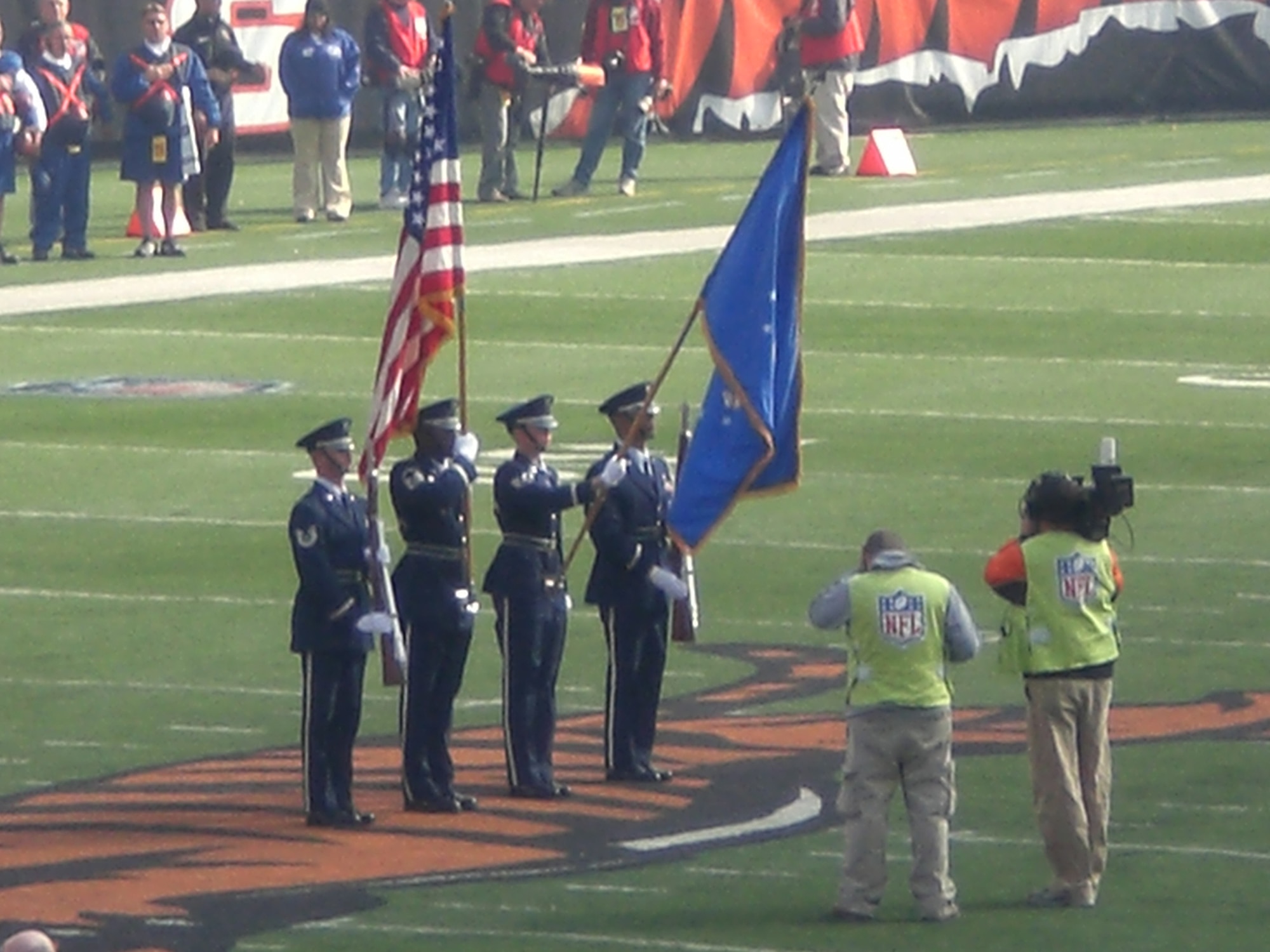 WRIGHT-PATTERSON AIR FORCE BASE, Ohio – From left to right, Tech. Sgt. Shawn McKellop, 445th Logistics Readiness Squadron, Master Sgt Mark Lyle, 88th Forces Support Squadron, Honor Guard Superintendent, Staff Sgt. Danielle Lytle, 88th Forces Support Squadron, Honor Guard, and Tech. Sgt. Eddy Wells, 88th Forces Support Squadron, Honor Guard, perform Oct. 31 during the Cincinnati Bengals versus Miami Dolphins football game in Cincinnati. (Courtesy photo)