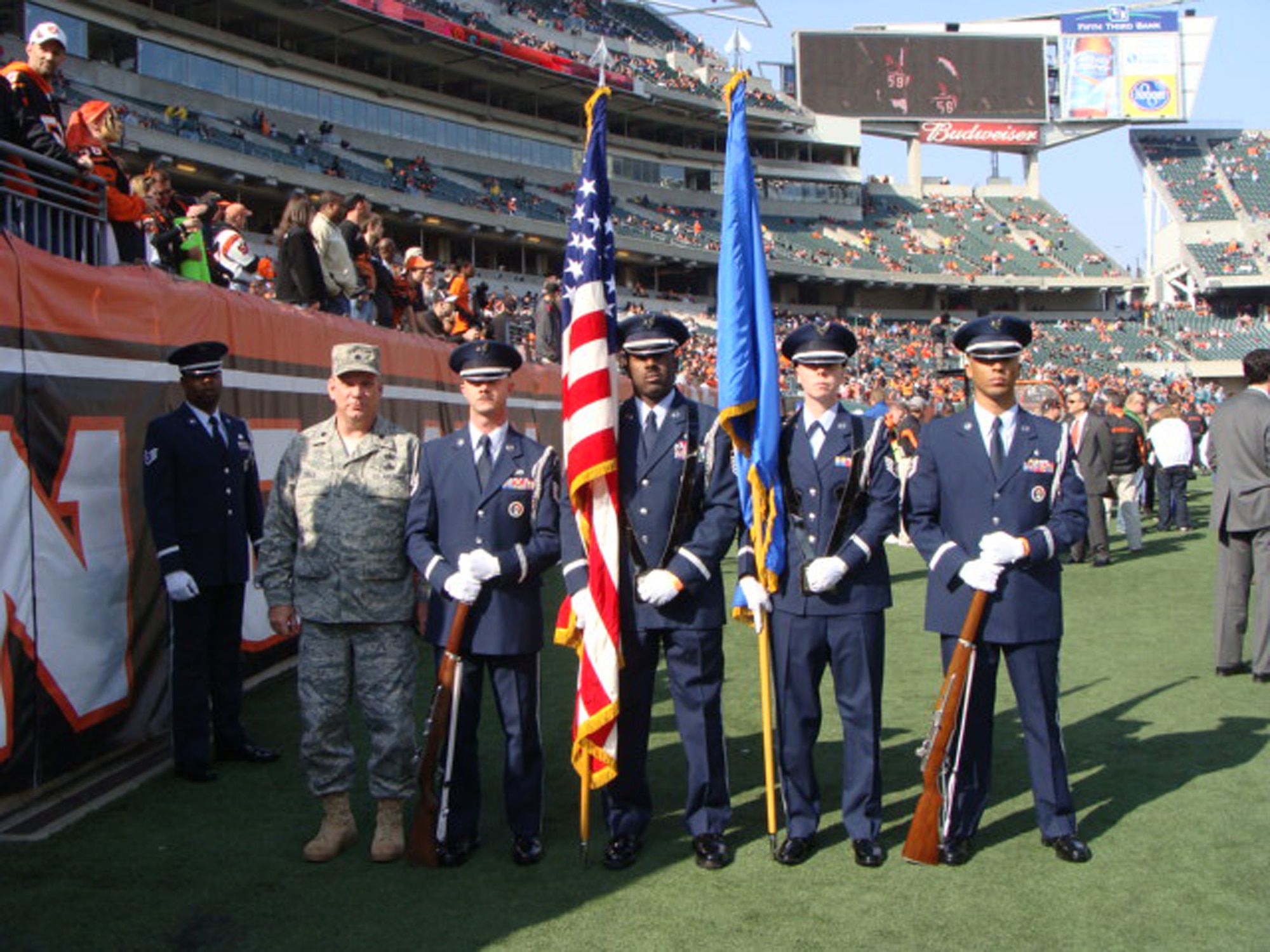 WRIGHT-PATTERSON AIR FORCE BASE, Ohio – Lt. Col. Donald Wren, 445th Logistics Readiness Squadron commander, accompanies Honor Guard members, from left to right, Tech. Sgt. Shawn McKellop, 445th LRS, Master Sgt Mark Lyle, Superintendent, 88th Forces Support Squadron, Honor Guard, Staff Sgt. Danielle Lytle, 88th Forces Support Squadron, Honor Guard, and Tech. Sgt. Eddy Wells, 88th Forces Support Squadron, Honor Guard, to the Oct. 31 Cincinnati Bengals versus Miami Dolphins football game in Cincinnati.  The Honor Guard performed during the pre-game festivities. (Courtesy photo)