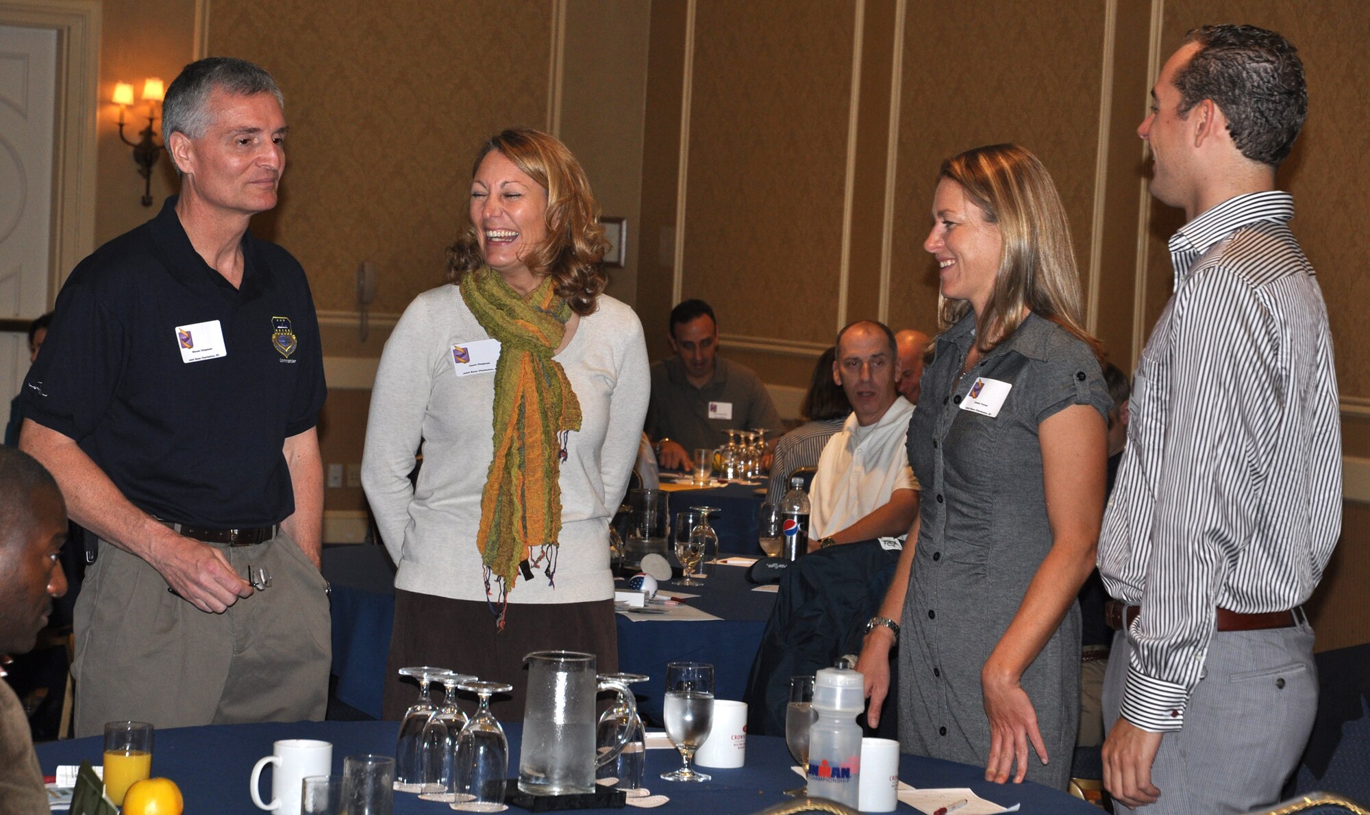 315 AW Commander Col. Steven J. Chapman and his wife Janet, share stories with Capt. Jamie Turner, a pilot with the 315 AW and her guest at the Yellow Ribbon Program event Nov. 12-14, 2010 at Hilton Head, S.C.  (U.S. Air Force photo/Airman 1st Class Robert Pilch)