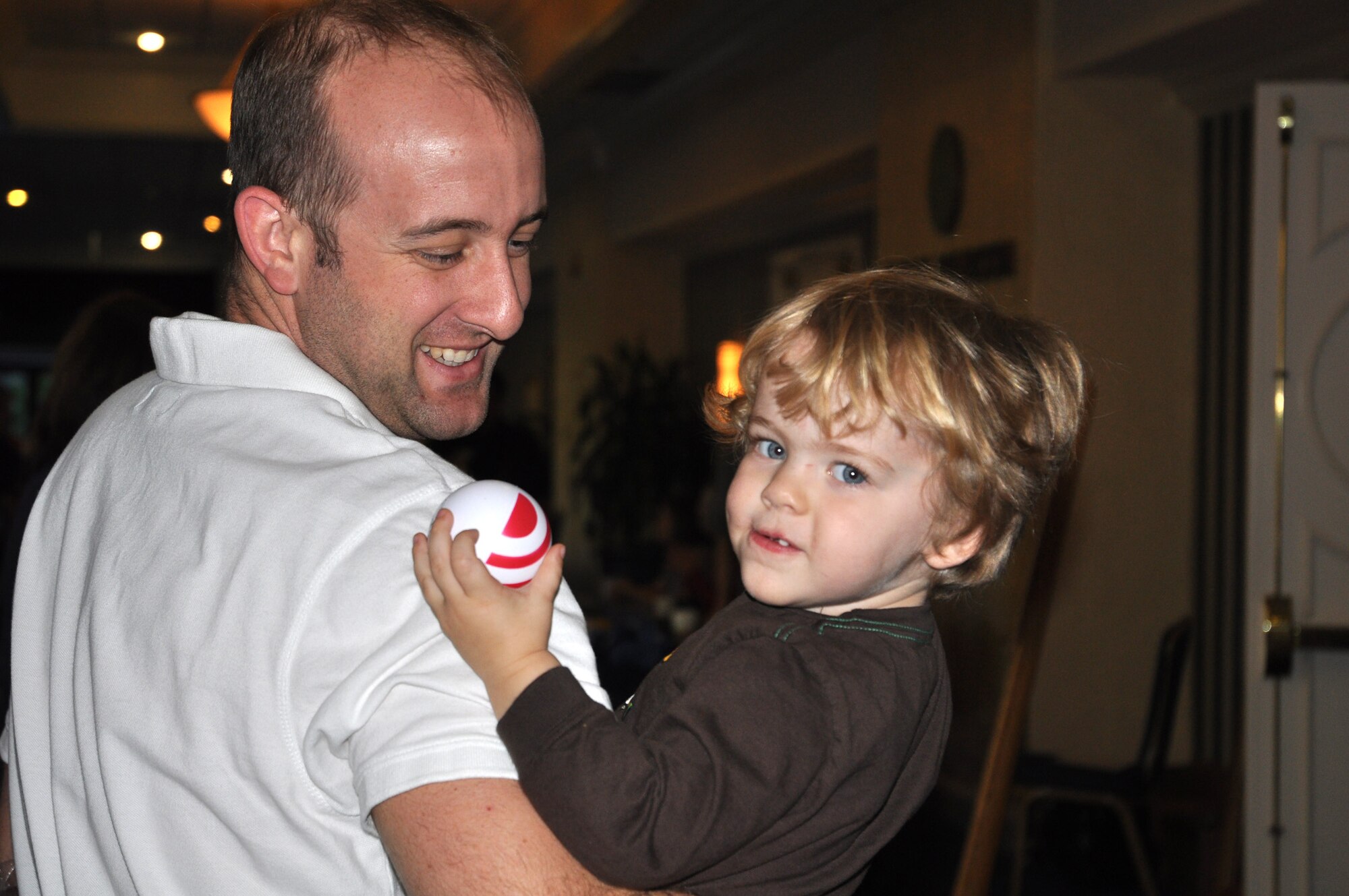 Tech. Sgt. J.J. Hoffman with the 300th Airlift Squadron and his son, visit the various service providers for families at the Yellow Ribbon Program event Nov. 12-14, 2010 at Hilton Head, S.C.  (U.S. Air Force photo/Airman 1st Class Robert Pilch)