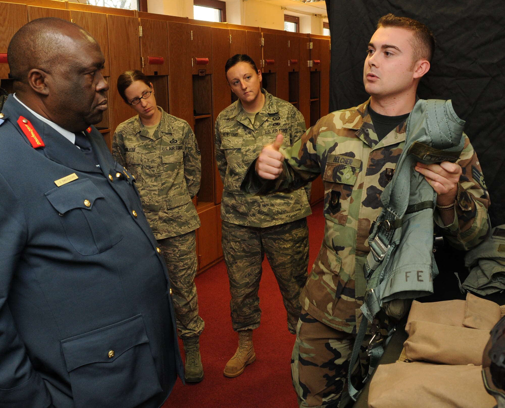 SPANGDAHLEM AIR BASE, Germany – Senior Airman Mark Belcher, right, 52nd Operations Support Squadron aircrew flight equipment journeyman, explains the purpose of life support equipment worn by pilots to Maj. Gen. Jim Beesigye Owoyesigire, Ugandan Peoples Defense Air Force commander, during his visit Nov. 10. General Owoyesigire toured several squadrons on Spangdahlem Air Base to gain a greater understanding of how the U.S. Air Force operates. (U.S. Air Force photo/Staff Sgt. Benjamin Wilson)