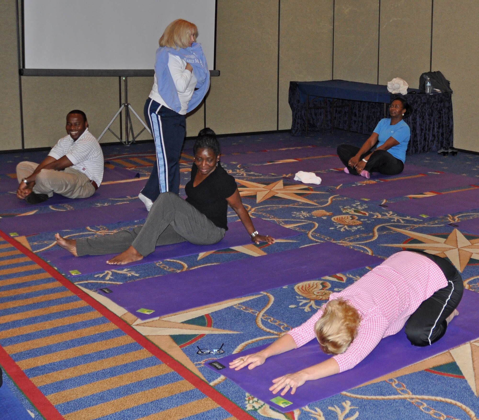 Participants from the 315 AW, Joint Base Charleston, S.C. and 439 AW from Westover Air Reserve Base, Mass., learn yoga and relaxation techniques to help cope with stress and promote mental and physical wellness at the Yellow Ribbon Program event Nov. 12-14, 2010 at Hilton Head, S.C.,  (U.S. Air Force photo/Airman 1st Class Robert Pilch)