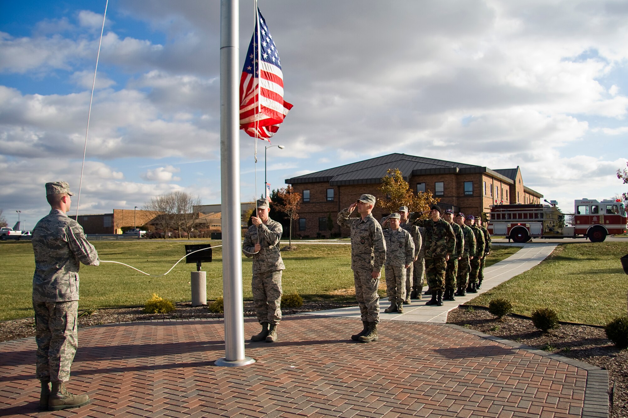 GRISSOM AIR RESERVE BASE, Ind. -- Firefighters with the 434th Civil Engineer Squadron participate in a retreat ceremony here during the November unit training assembly. Retreat ceremonies are held each day at Grissom and serve a two-fold purpose. They signal the end of the official duty-day and serve as a ceremony for paying respect to the flag. (U.S. Air Force photo/Tech. Sgt. Mark R. W. Orders-Woempner)
