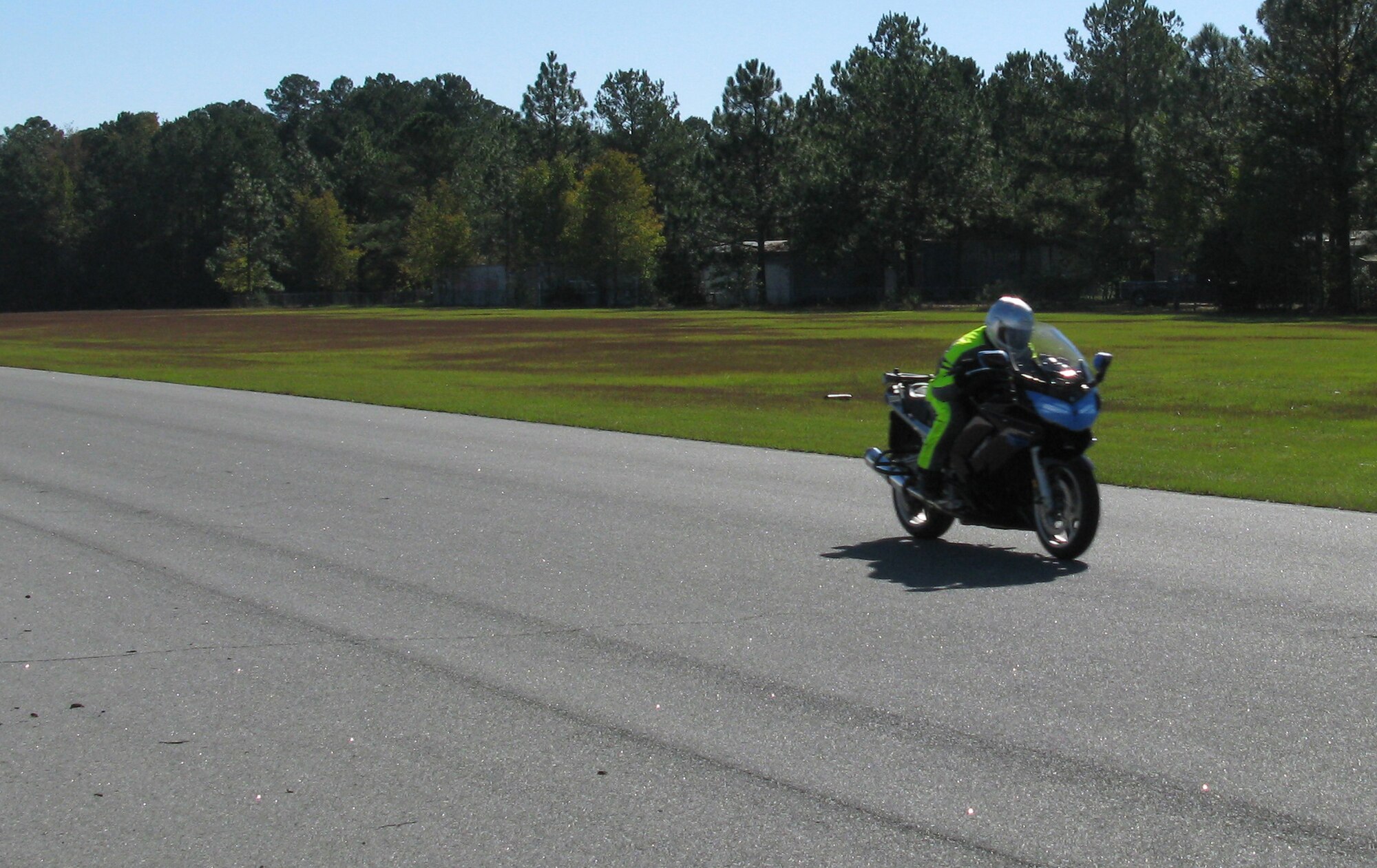 Master Sgt. Joseph Botkin throttles up at the Roebling Road Track in Bloomingdale, Ga., Nov. 8, 2010, during Air Force Reserve Command motorcycle safety stand down day. AFRC Safety Office offered the free one-day course to help military motorcycle riders practice skills that will help them negotiate hazards on the road. (U.S. Air Force photo/Master Sgt. Rachael Cox)