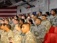 US ARMY GARRISON YONGSAN, Republic of Korea -- Members of the 8th Fighter Wing wait for President Barack Obama to begin his speech at U.S. Army Garrison Yongsan, Republic of Korea, Nov. 11. More than 50 Wolf Pack Airmen traveled to Yongsan to hear the President's Veterans Day speech. (U.S. Air Force photo/Staff Sgt. Amanda Savannah)