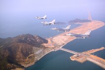 KUNSAN AIR BASE, Republic of Korea -- Four F-16 Fighting Falcons fly over the Saemangeum Seawall during a U.S. and Republic of Korea Air Force Coalition flight Nov. 10 in celebration of the 60th anniversary of the Korean War. (U.S. Air Force photo/Master Sgt. Jason Wilkerson)