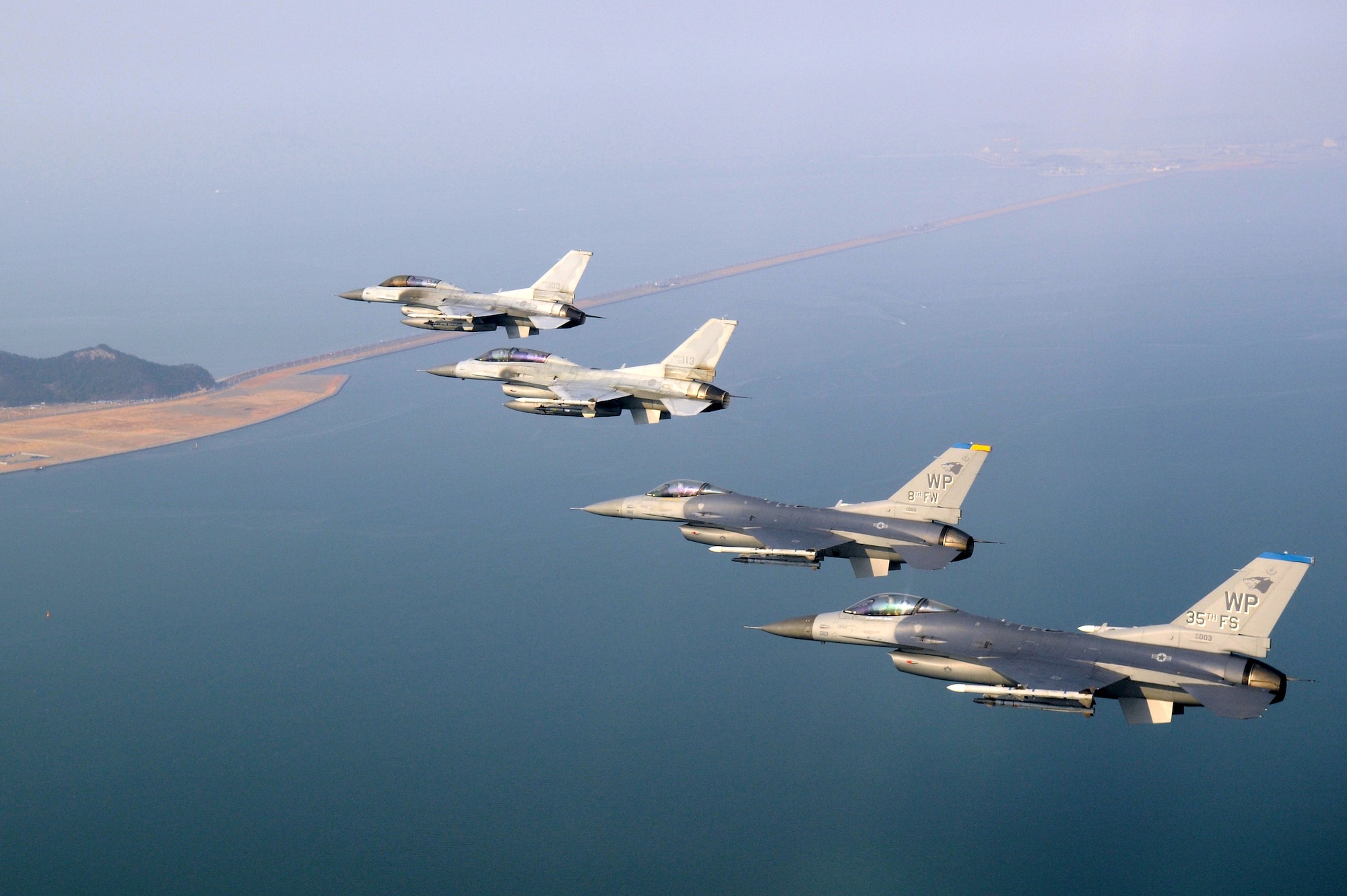 KUNSAN AIR BASE, Republic of Korea -- Four F-16 Fighting Falcons fly over the Saemangeum Seawall during a U.S. and Republic of Korea Air Force Coalition flight Nov. 10 in celebration of the 60th anniversary of the Korean War. (U.S. Air Force photo/Master Sgt. Jason Wilkerson)
