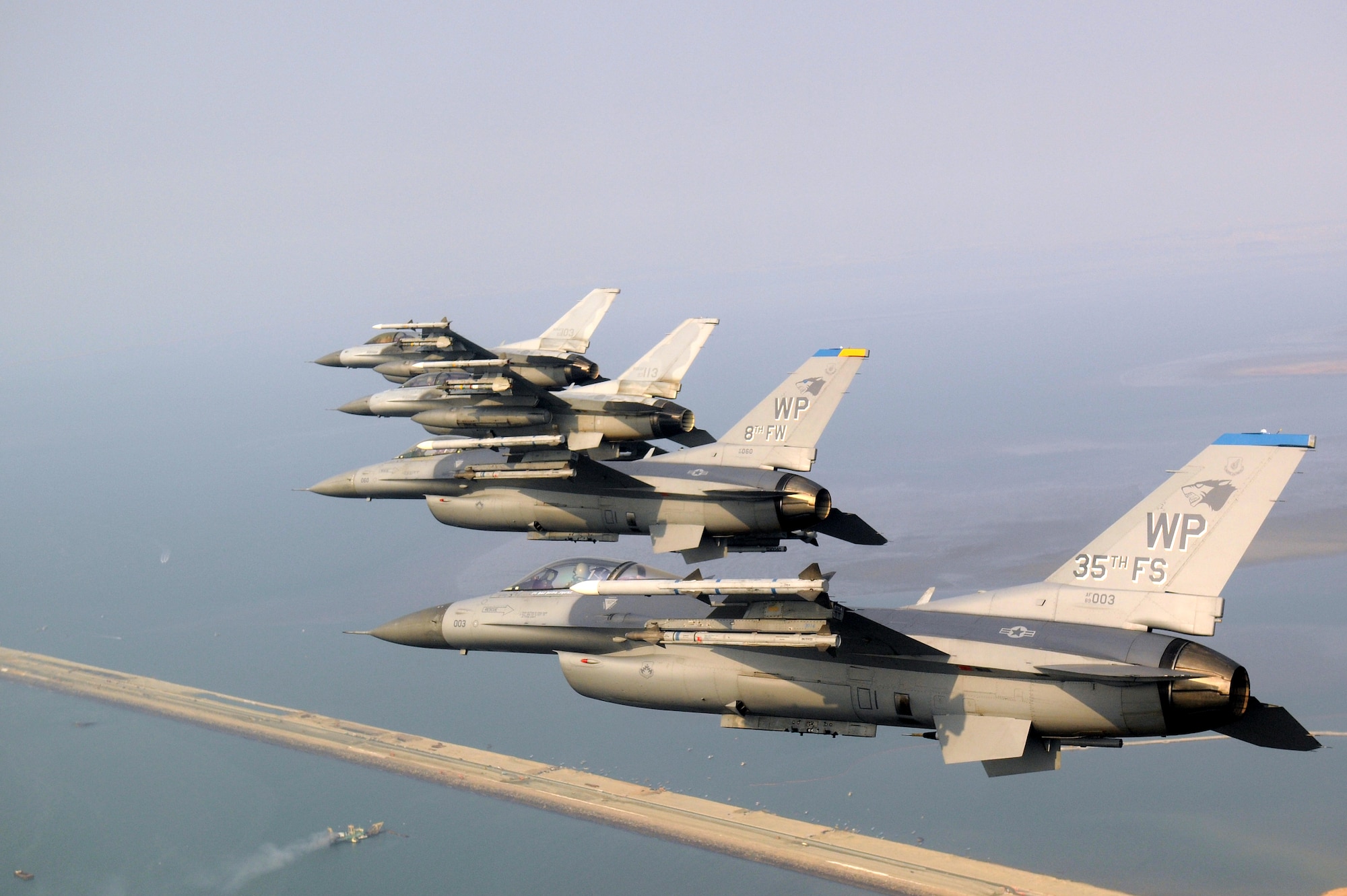 KUNSAN AIR BASE, Republic of Korea -- Four F-16 Fighting Falcons fly over the Saemangeum Seawall during a U.S. and Republic of Korea Air Force Coalition flight Nov. 10 in celebration of the 60th anniversary of the Korean War. (U.S. Air Force photo/Master Sgt. Jason Wilkerson)