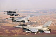KUNSAN AIR BASE, Republic of Korea -- Four F-16 Fighting Falcons fly over Kunsan AB during a U.S. and Republic of Korea Air Force Coalition flight Nov. 10 in celebration of the 60th anniversary of the Korean War. (U.S. Air Force photo/Master Sgt. Jason Wilkerson)