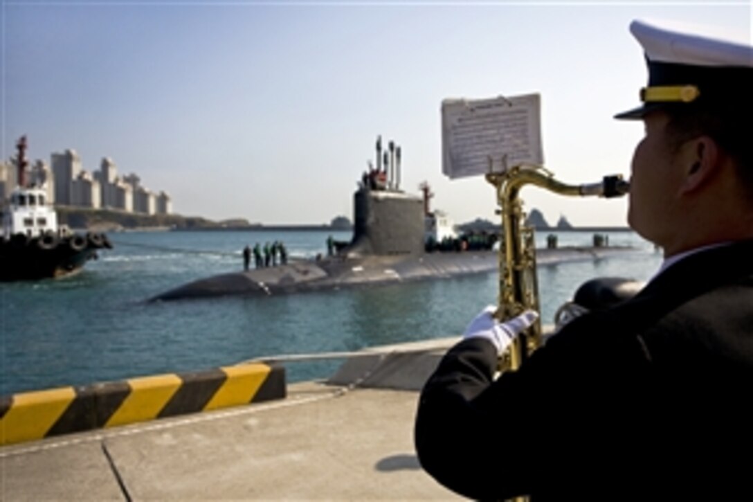 Sailors from South Korea's navy band perform the Dixieland Strut as the Virginia-class attack submarine USS Hawaii arrives in Busan for a routine port visit, Nov. 10, 2010. The Hawaii, homeported in Pearl Harbor, Hawaii, is on a scheduled deployment to the 7th Fleet area of responsibility. This is the first time a Virginia-class submarine has visited the the country.