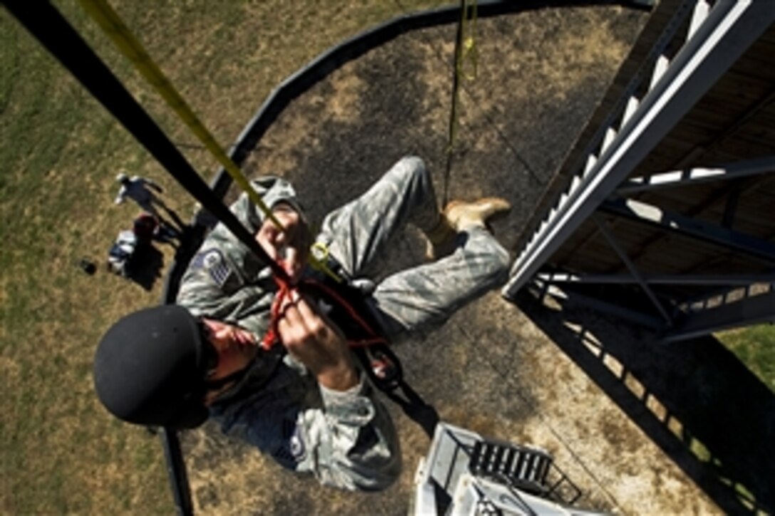 U.S. Air Force Staff Sgt. William Hierholzer rescues himself during the rappel masters certification course on Camp Bullis, Texas, Nov. 5, 2010. Individuals attending the five-day rappel course learn 13 different knots, self-rescue techniques, and how to descend down a wall and safely slide down. Hierholzer is the combat leadership course instructor.