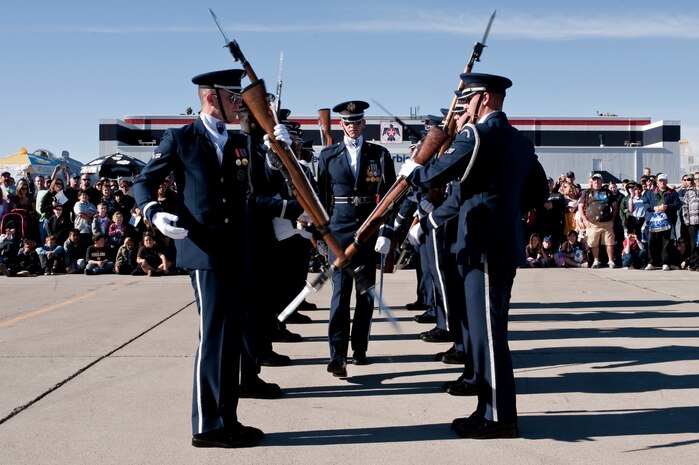 NELLIS AIR FORCE BASE, Nev.-- Capt. Chad Frey, U.S. Air Force Honor Guard Drill Team, flight commander from Bolling Air Force Base, Washington D.C.  walks through the gauntlet during a performance on the Nellis flightline Nov. 13. The performance was  part of the 2010 Aviation Nation Nellis Open House.  (U.S. Air Force photo by Tech. Sgt. Michael R. Holzworth)(Released)