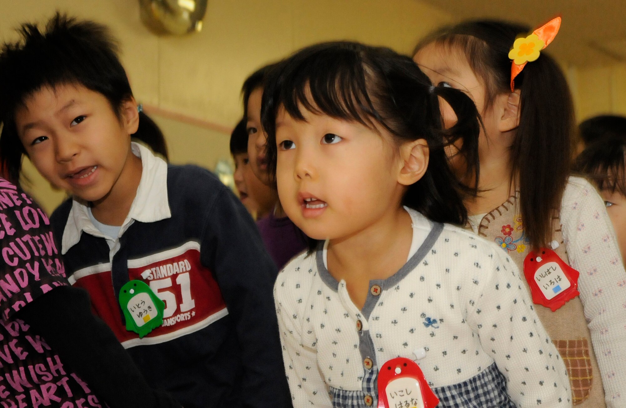 A group of students from the Hokuto preschool bow to Kadena Airmen as they arrive at their school in Chitose, Japan, Nov. 15, 2010.   A dozen Airmen based out of Kadena Air Base paid a visit to the school during their temporary duty. Nearly 200 Airmen are at Chitose Air Base, Japan as part of an Aviation Training Location designed to enhance bilateral relations between Japan and the U.S. (U.S. Air Force photo by Tech. Sgt. Mike Tateishi)