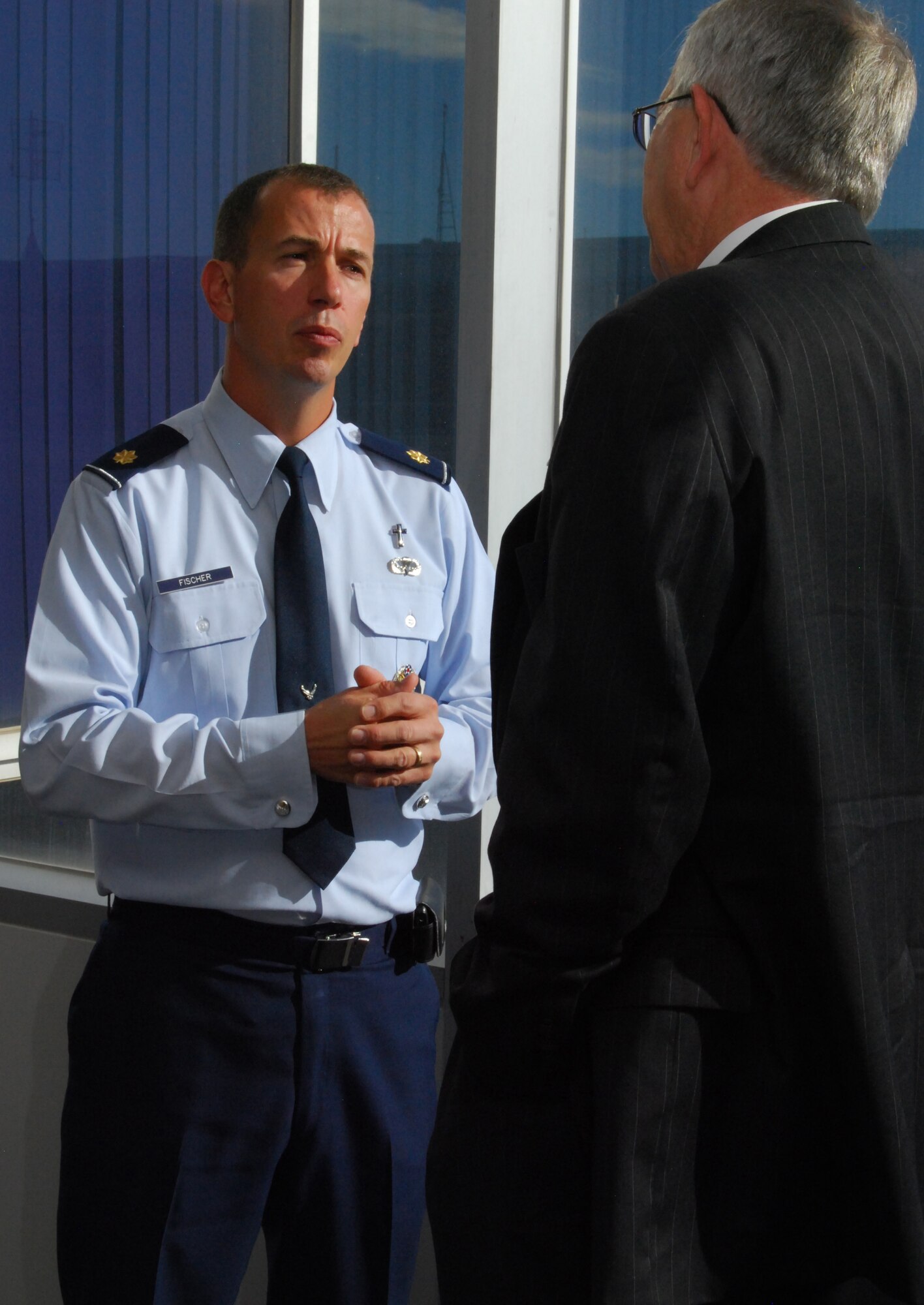 Chaplain (Maj.) Peter Fischer and the Right Reverend James Magness talk outside the Dean of Faculty Conference Room at the Air Force Academy during a break at the Religious Respect Conference at the Academy Nov. 16, 2010. Topics at the conference included balancing freedom of religious expression with the Constitution's prohibition against establishing or endorsing religion. Chaplain Fischer is the Academy's senior protestant chaplain. Reverend Magness is the bishop suffragan for federal ministries for the Office of Federal Ministries of the Episcopal Church. (U.S. Air Force photo/Staff Sgt. Don Branum)