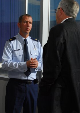 Chaplain (Maj.) Peter Fischer and the Right Reverend James Magness talk outside the Dean of Faculty Conference Room at the Air Force Academy during a break at the Religious Respect Conference at the Academy Nov. 16, 2010. Topics at the conference included balancing freedom of religious expression with the Constitution's prohibition against establishing or endorsing religion. Chaplain Fischer is the Academy's senior protestant chaplain. Reverend Magness is the bishop suffragan for federal ministries for the Office of Federal Ministries of the Episcopal Church. (U.S. Air Force photo/Staff Sgt. Don Branum)