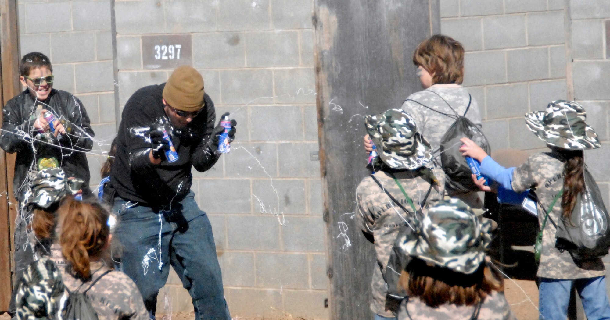Youths participating in Operation KIDS 2010 put their skills to the test as they were ambushed just outside Camp Discovery Nov. 13, 2010, at Goodfellow Air Force Base, Texas. More than 60 military youths participated in this year's event to get a glimpse of what their military parents go through when deploying. (U.S. Air Force photo/Connie Hempel)
