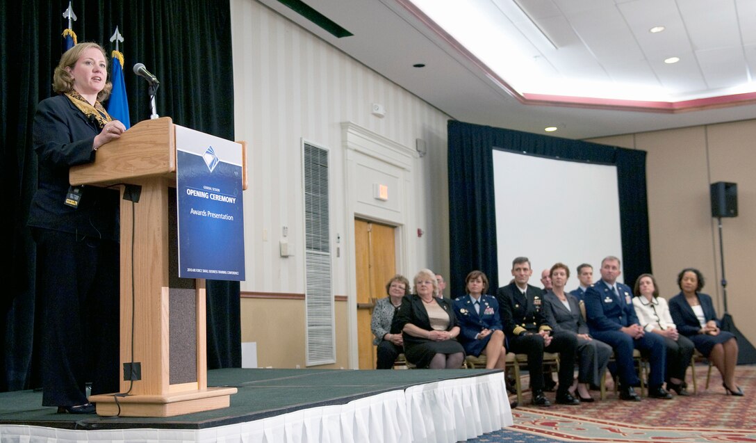 Undersecretary of the Air Force Erin C. Conaton presents awards during the Air Force Small Business Fall Training Conference Nov. 15, 2010, in Arlington, Va. (U.S. Air Force photo/Jim Varhegyi)