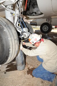 Matt McLendon of Express Metalwork Steel Fabrication welds the base support for the T-43 in preparation for display (U.S. Air Force photo/Melissa Peterson)