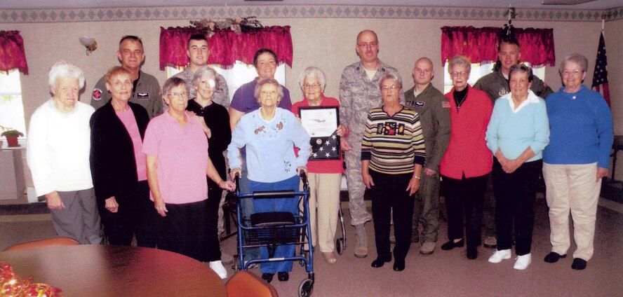 Airmen of the 914th Airlift Wing Tech Sgt. Volker Kiefer, Senior Airman Jack Millar, Capt. Mike Hocutt, Senior Airman Henry Carpenter and Senior Airman Ryan Marr stand with the women of St. Issac's knitting and crocheting guild in Wheatfield,N.Y,last month, The women have been making blankets for wounded servicemembers in Iraq and Afghanistan. 