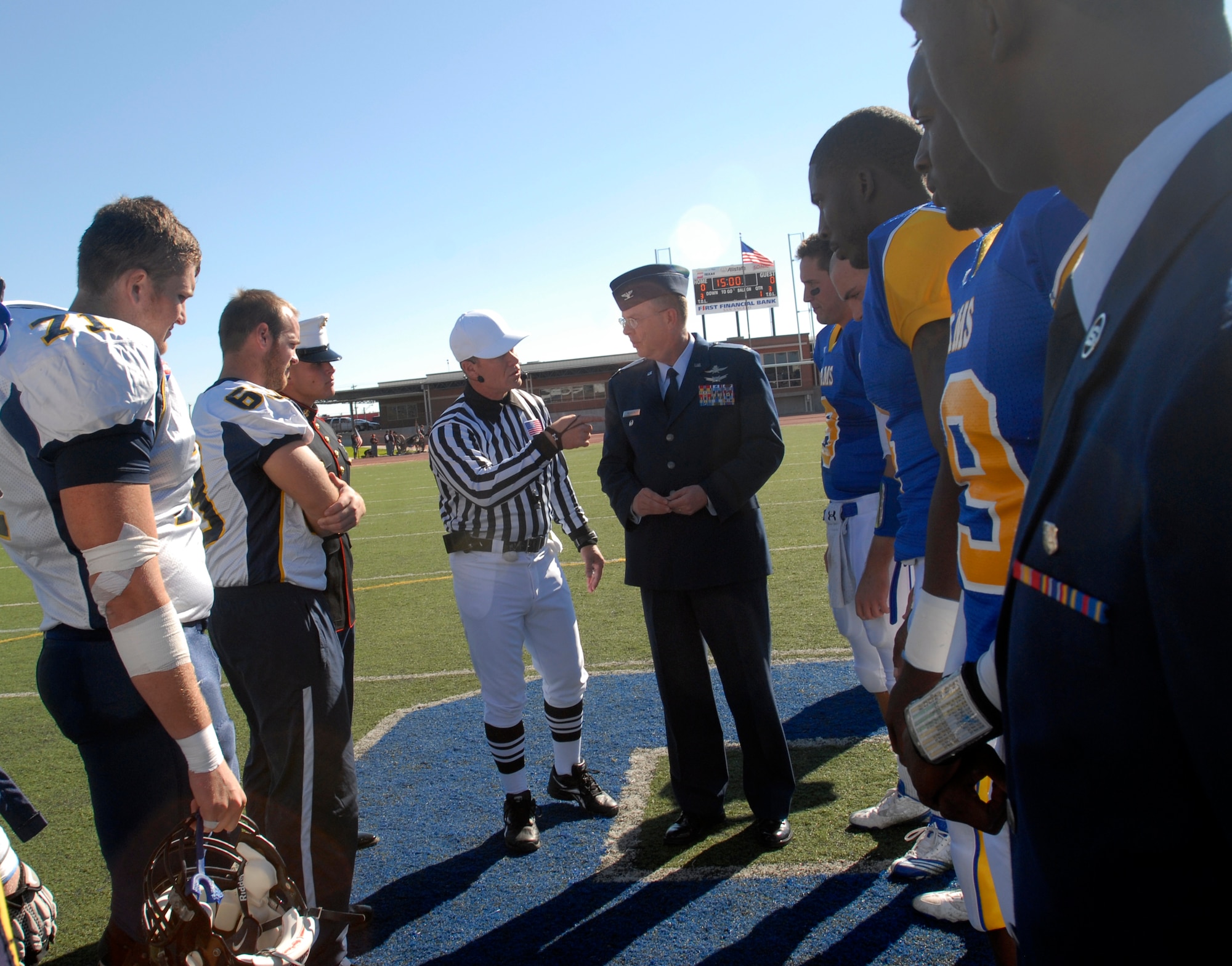 Col. David Rearick, 17th Training Wing Vice Commander, prepares to toss the coin to determine who will be the receiving team before the start of the Angelo State vs. Central Oklahoma football game Nov. 13.  Angelo State University and local groups sponsored several events to show their appreciation to all active duty and retired military personnel and their families. (U.S. Air Force photo/Master Sgt. Randy Mallard)
