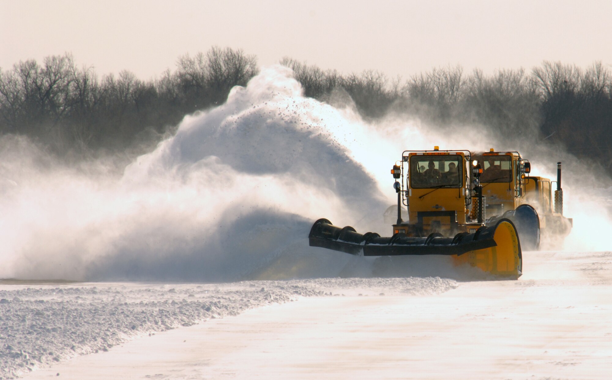 WHITEMAN AIR FORCE BASE, Mo. - The 509th Civil Engineer Squadron pavements and equipment shop uses 20-foot plows to clear snow off the airfield, Jan. 7. (U.S. Air Force photo by Senior Airmen Jessica Snow)