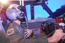 MINOT AIR FORCE BASE, N.D. -- A pilot with the 5th Operations Support Squadron here practices correction procedures with a reduced oxygen breathing device in the flight simulator Nov. 4. Training like this is important for Air Force Global Strike Command aircrew members to maintain their readiness in support of the 5th Bomb Wing's strategic deterrence mission. (U.S. Air Force photo/Laurie Arellano)