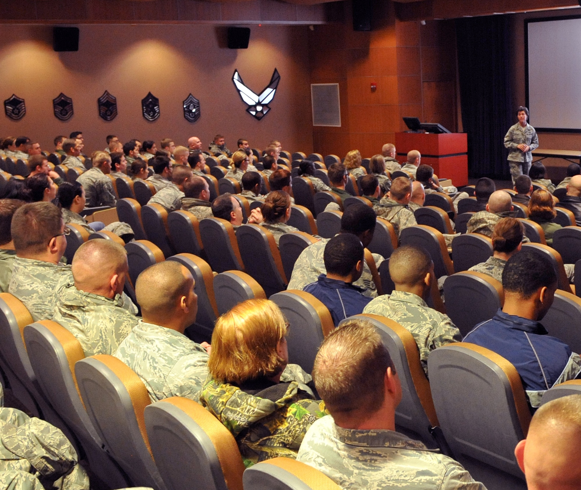 OFFUTT AIR FORCE BASE, Neb. - Lt. Col Dana McCown, 55th Maintenance Squadron commander, speaks to a room full of 55th Wing Airmen Nov. 12 about the devasting effects a drunk driver has had in her life. Both of her parents were killed when a drunk driver ran into their vehicle a few years ago. The presentation was one of several events and briefings during Wingman Day 2010 to promote teamwork and educate Airmen on such things as suicide prevention and the dangers of drinking and driving. U.S. Air Force photo by Jeff W. Gates. 