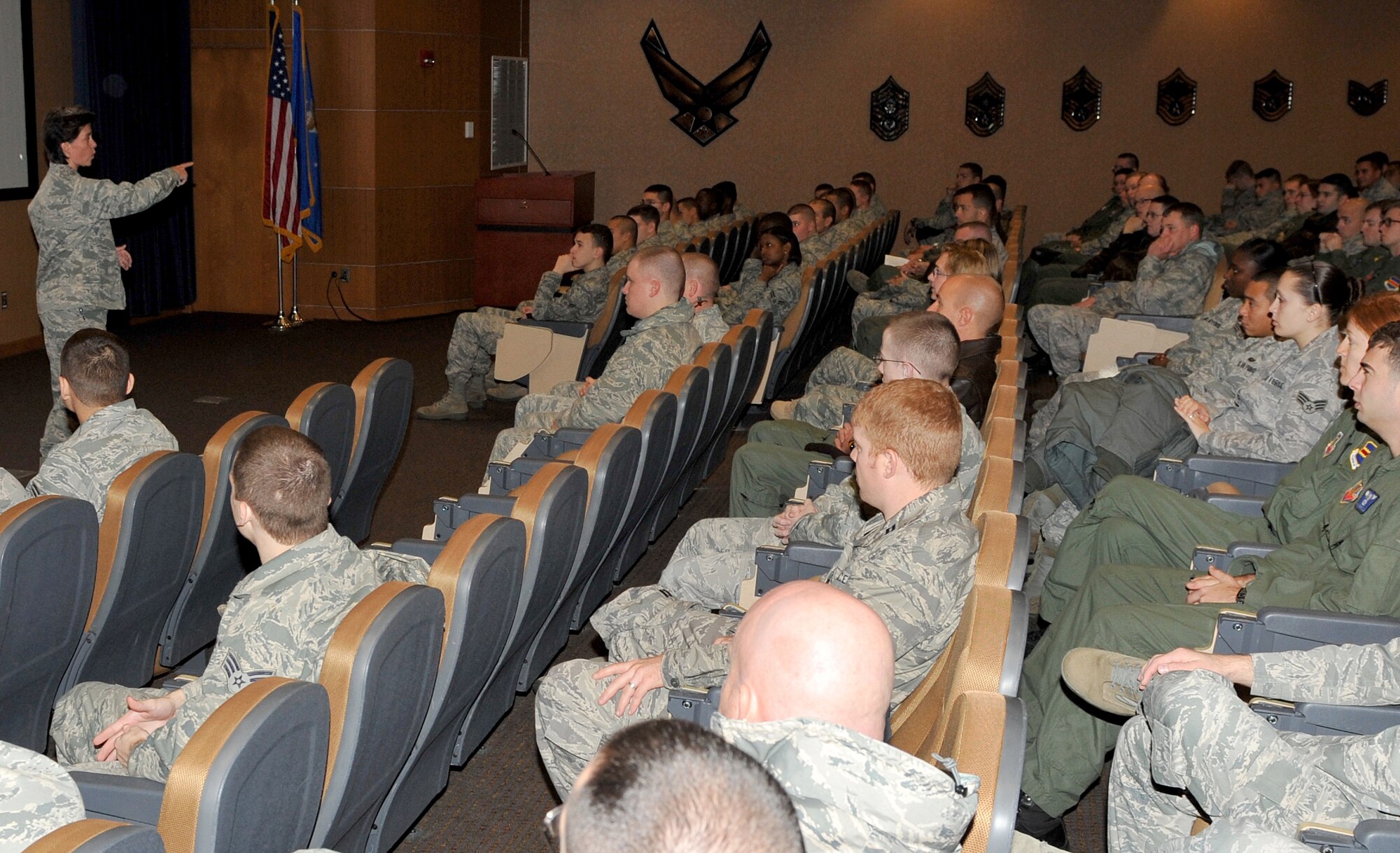 OFFUTT AIR FORCE BASE, Neb. - Lt. Col Dana McCown, 55th Maintenance Squadron commander, speaks to a room full of 55th Wing Airmen Nov. 12 about the devasting effects a drunk driver has had in her life. Both of her parents were killed when a drunk driver ran into their vehicle a few years ago. The presentation was one of several events and briefings during Wingman Day 2010 to promote teamwork and educate Airmen on such things as suicide prevention and the dangers of drinking and driving. U.S. Air Force photo by Jeff W. Gates. 
