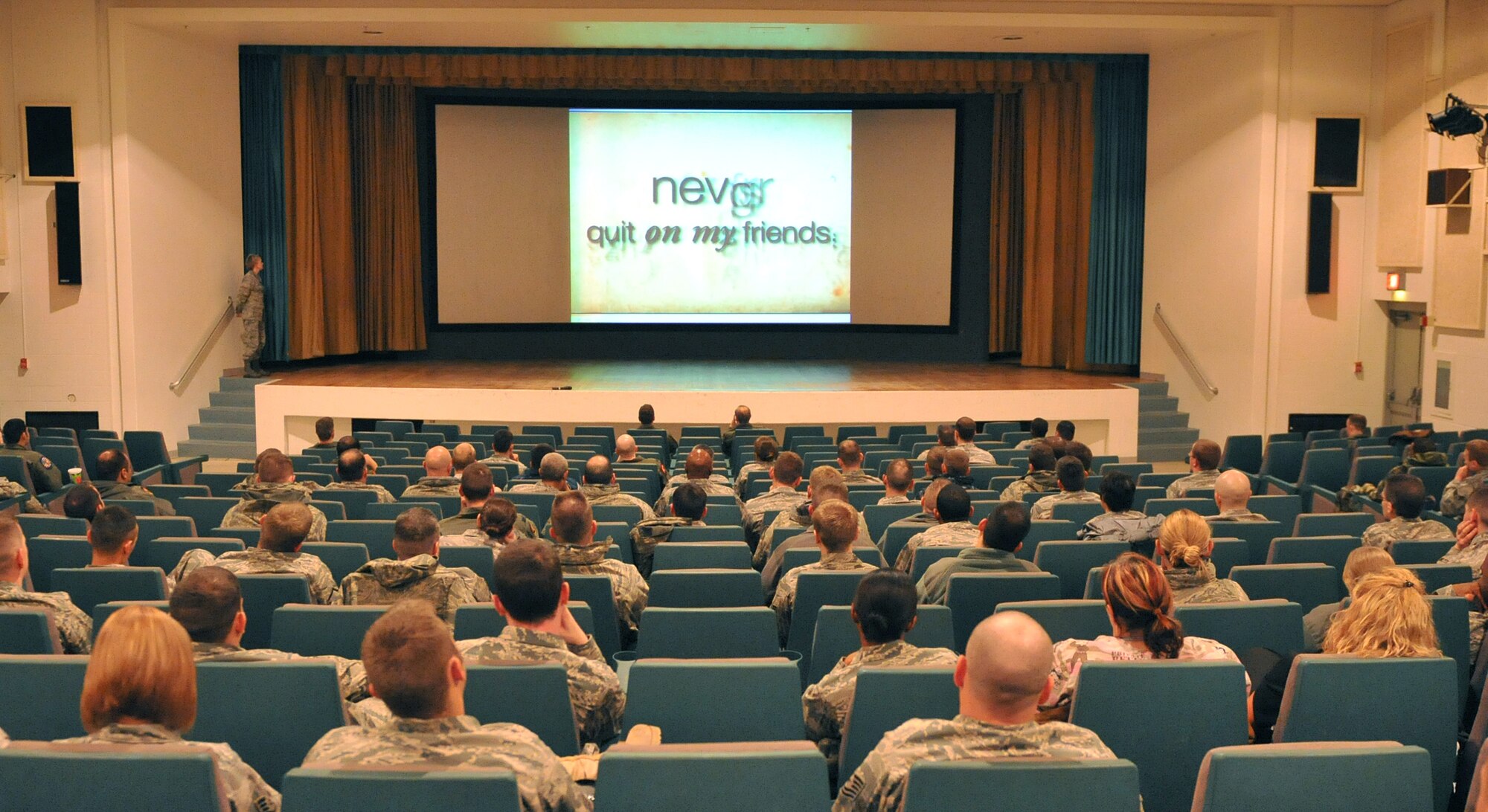 OFFUTT AIR FORCE BASE, Neb. -- Captain Rabecca Stahl, a member of the 55th Medical Operation Squadron Mental Health Clinic, shows a slideshow on the signs of suicide and its effects on Airmen.  Airmen in the 55th Wing took part in various events and briefings during the day to promote teamwork and educate Airmen on topics such as suicide prevention and the dangers of drinking and driving. U.S. Air Force photo by Jeff W. Gates. 