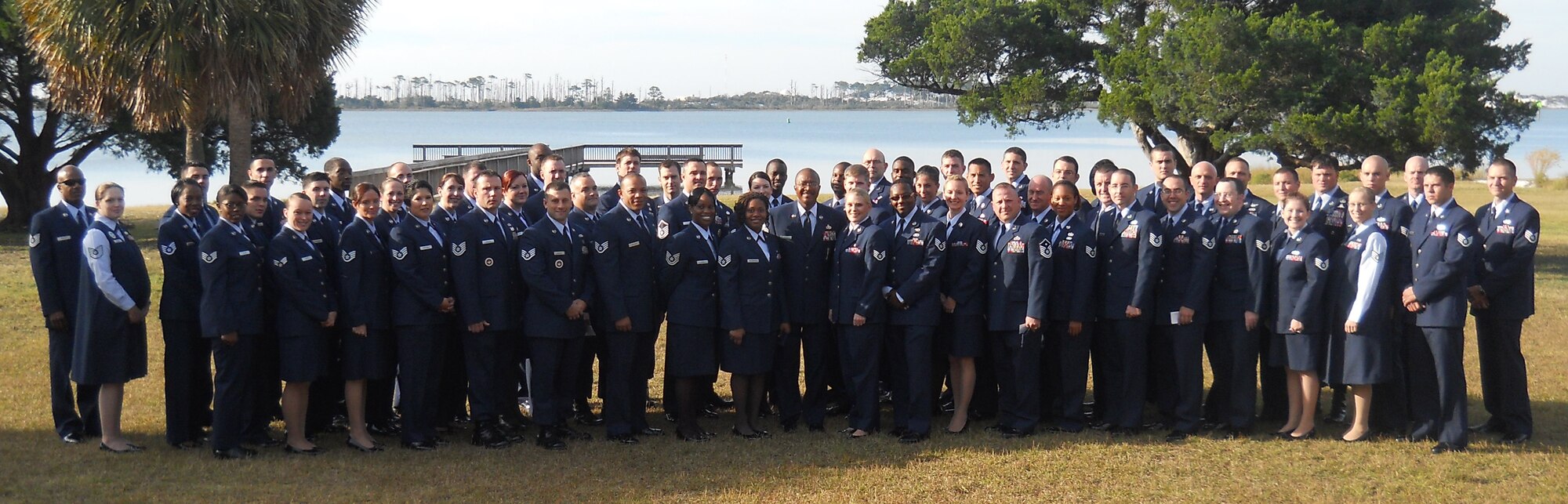 Chief Master Sgt. Dexter Mitchell, 1st Special Operations Wing command chief, center, poses with Airmen before they receive their Community College of the Air Force associate degrees during a graduation ceremony at the Soundside Club at Hurlburt Field, Fla., Nov. 10, 2010. Approximately 347 Airmen earned CCAF degrees in 2010, the most in Hurlburt Field's history. (Courtesy photo)