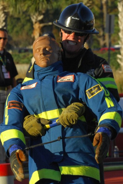 MYRTLE BEACH, S.C. -- Senior Airman Garrett Pope, 20th Civil Engineer firefighter, drags the 175-pound dummy to the finish line for the final leg of the five-man relay during the World Scott Firefighter Combat Challenge Nov. 13. The competition is considered "the toughest two minutes in sports" and seeks to encourage firefighters' fitness, as well as demonstrates the challenges of the profession to the public. The Shaw firefighters five-man relay placed 16th among 175 different teams from across the U.S., as well as from France, Germany, Slovenia, Canada and New Zealand at the competition. (U.S. Air Force photo/Airman 1st Class Daniel Phelps (Released))