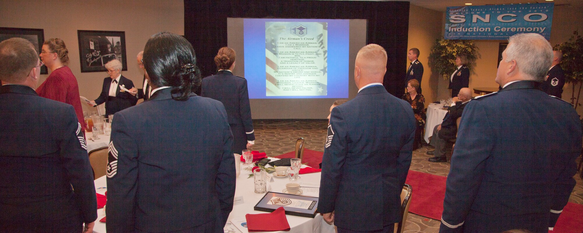 Members of the 189th Airlift Wing stand and recite the Airman's Creed Nov. 6, 2010, during an Arkansas Air National Guard Senior NCO induction ceremony at Little Rock Air Force Base, Ark. (U.S. Air Force photo by Master Sgt. Dianna Seerey)