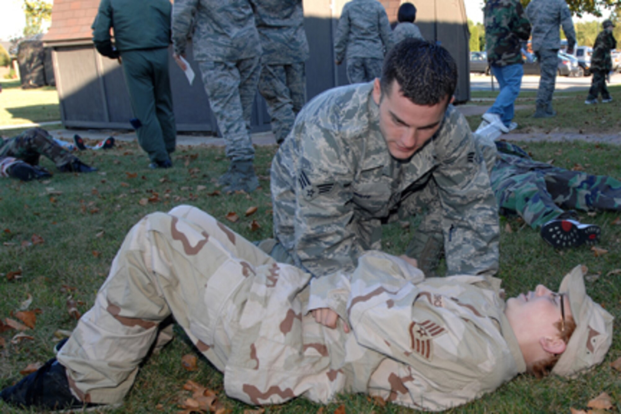 GRISSOM AIR RESERVE BASE, Ind. -- Senior Airman Garrett Boye, 434th Aerospace Medicine Squadron service technician, opens the breathing airways of Shawn DePloy, Boy Scout Troop 229 member, during the 434th AMDS annual mass casualty exercise. Scout members acted as casualty victims to add a sense of realism to the exercise. (U.S. Air Force photo/Senior Airman Carl Berry).