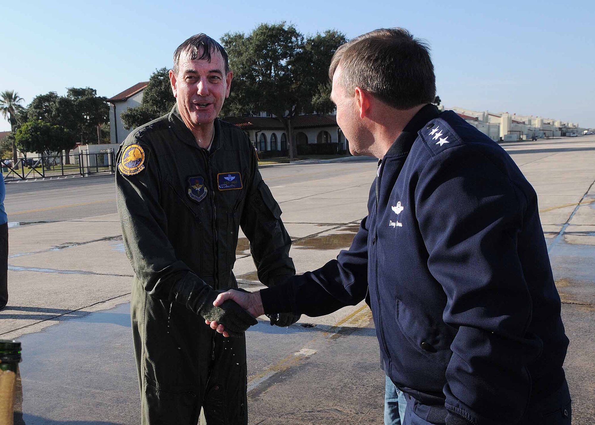 Gen. Stephen R. Lorenz, Commander, Air Education and Training Command, left, is greeted by Lt. Gen. Douglas H. Owens, Air Education and Training Command vice commander, Nov. 14, after completing his fini flight at Randolph AFB,
Texas. General Lorenz will retire in the grade of general effective Jan. 1,
2011, culminating more than 37 years of commissioned service. His retirement ceremony is Nov. 17 at Randolph AFB, Texas. (U.S. Air Force photo/David
Terry)