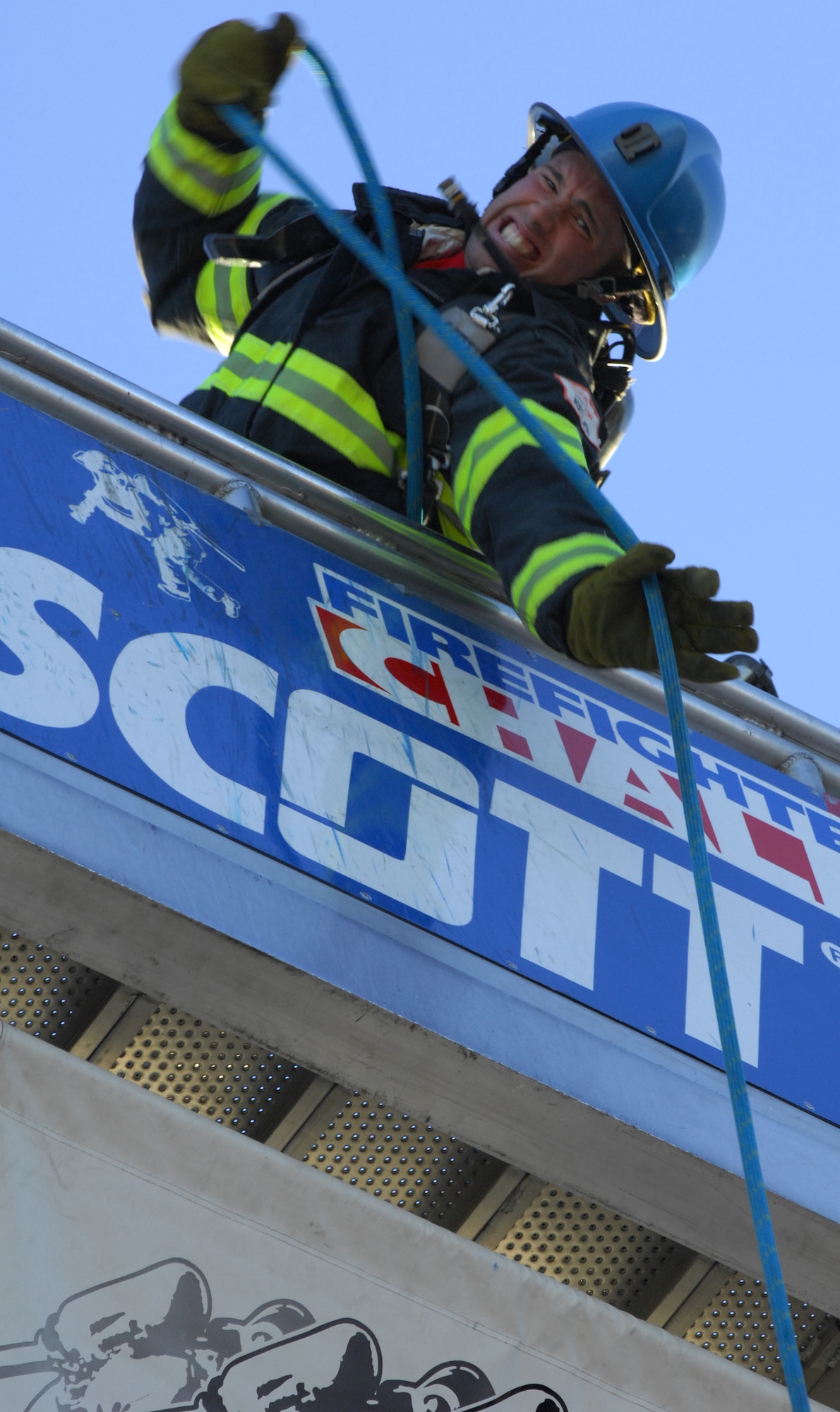 MYRTLE BEACH,S.C. -- Staff Sgt. Steven Thomas, 20th Civil Engineer Squadron firefighter, pulls a 45-pound hose up five stories to the top of the tower during the Scott Firefighter Combat Challenge during the world competition Nov. 13th. The competition is considered "the toughest two minutes in sports" and seeks to encourage firefighters' fitness, as well as demonstrates the challenges of the profession to the public. Shaw firefighters placed 16th among 175 different teams from across the U.S., as well as from France, Germany, Slovenia, Canada and New Zealand at the competition. (U.S. Air Force photo/Airman 1st Class Daniel Phelps (Released))
