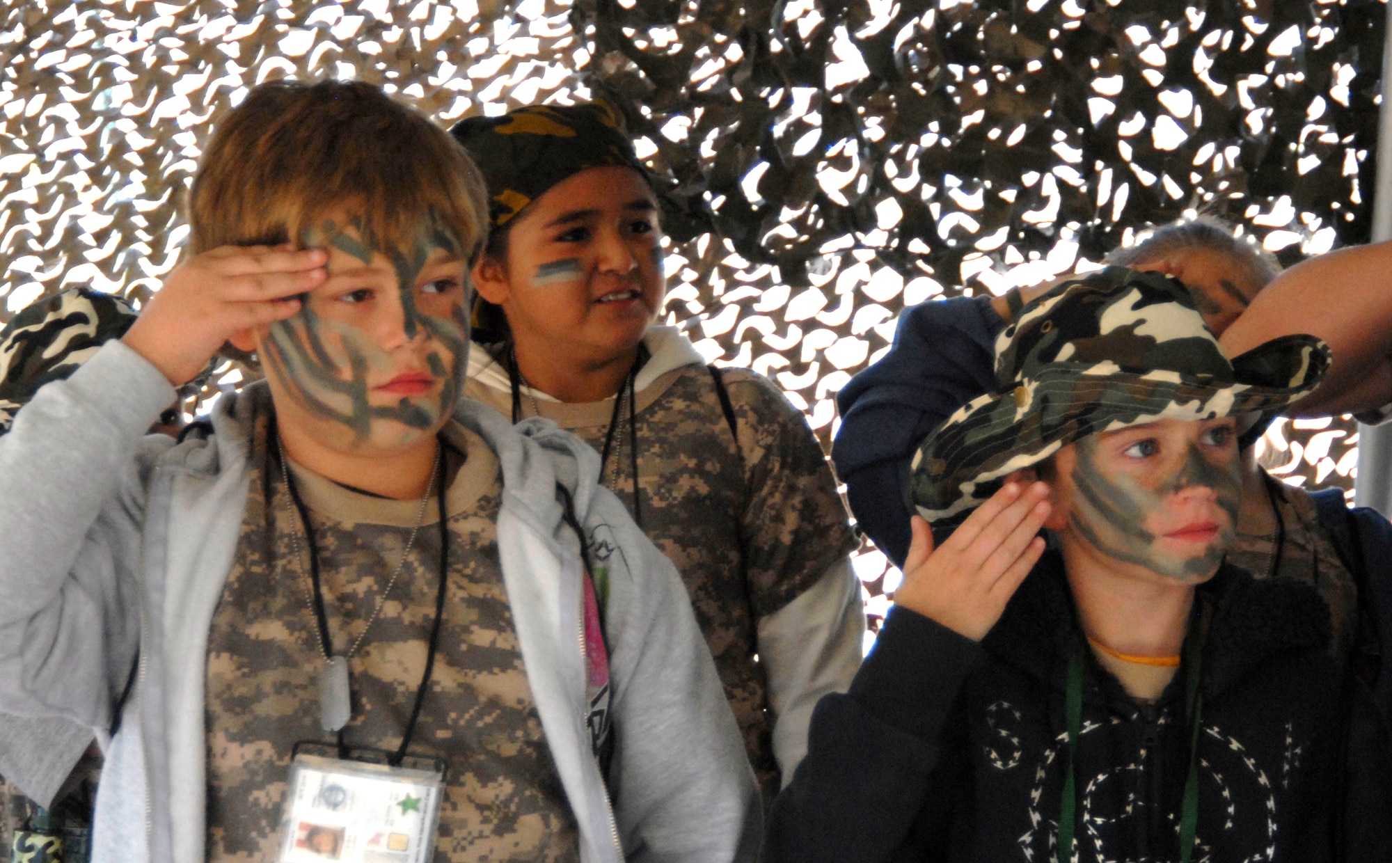 GOODFELLOW AIR FORCE BASE, Texas -- Brandon Fountain, 10, and Brandon Godin, 9, render a salute the Camp Discovery commanding officer before receiving their briefing.  (U.S. Air Force photo/Connie Hempel)