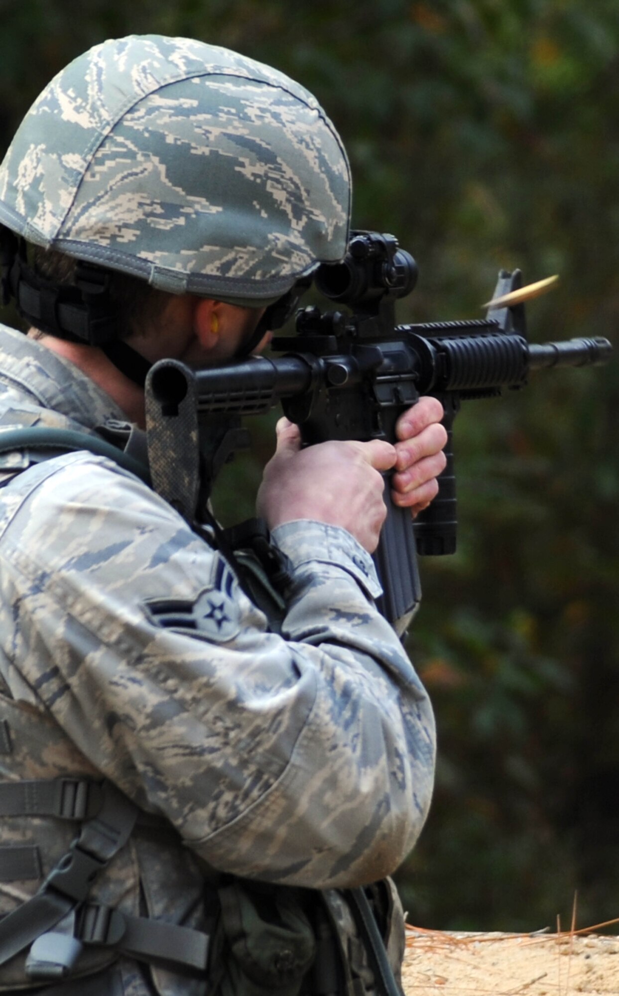 Airman 1st Class Joseph Mcilrath, 7th Security Forces Squadron from Dyess Air Force Base, Texas, fires his weapon during the M4 challenge portion of Global Strike Challenge at Fort Polk, La., Nov. 14. The event is the premier bomber, Intercontinental Ballistic Missile and security forces competition with units from Air Force Global Strike Command, Air Combat Command, Air Force Reserve Command and the Air National Guard. (U.S. Air Force photo/Senior Airman Brittany Y. Bateman)