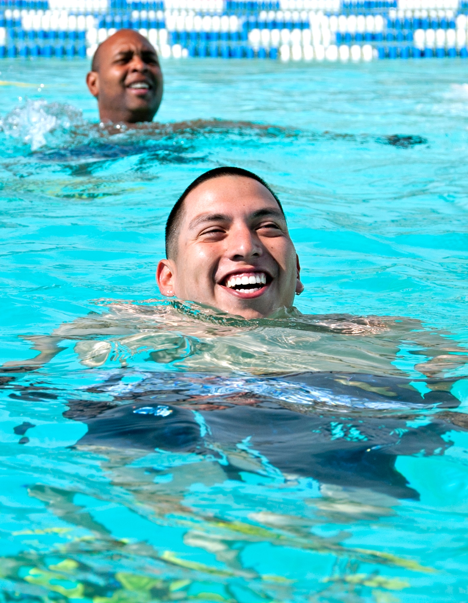 Senior Airman Henry Velasquez, 96th Forces Support Squadron, and Master Sgt. Mike Hill, 33rd Fighter Wing, tread water toward the next exercise during the pilot deep water running class in October.  Classes will be open to all military beginning Nov. 22.  (U.S. Air Force photo/ Samuel King Jr.)