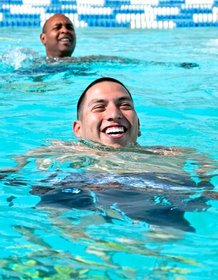 Senior Airman Henry Velasquez, 96th Force Support Squadron, and Master Sgt. Mike Hill, 33rd Fighter Wing, tread water toward the next exercise during the pilot deep water running class in October. Classes will be open to all military beginning Nov. 22. (U.S. Air Force photo/ Samuel King Jr.) 

