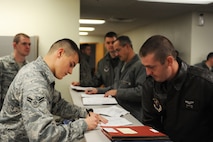 MINOT AIR FORCE BASE, N.D. -- Capt. Jacob Aultman, 69th Bomb Squadron navigator, processes through the deployment processing line here Nov. 12. Lt. Col. Michael Cardoza, 69th Bomb Squadron commander, and the Nighthawks are scheduled to deploy to Andersen AFB, Guam, in support of U.S. Pacific Command’s Continuous Bomber Presence, this will be the first time they deploy since the Vietnam War. (U.S. Air Force photo/ Airman 1st Class Aaron-Forrest Wainwright)